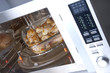 Chicken legs on a glass dish in the convection oven