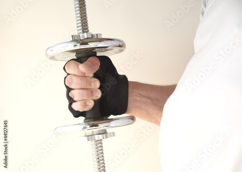 Photo: weight in man's hand weight in man's hand