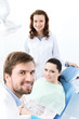 Dentist, his assistant and the patient