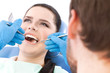 Dentist examines the oral cavity of a patient