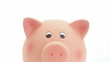 Saving money: hand putting coins in a piggy bank. Isolated