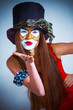 portrait of a girl clown with painted face.