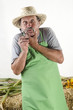 Foto: organic farmer with glasses and a green apron organic farmer with glasses and a green apron