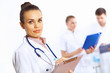 Photo: Young female doctor in white uniform Young female doctor in white uniform