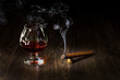 Glass of cognac and sigar