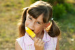 Beautiful young girl enjoys a ice cream