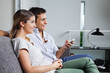 Couple Sitting Together On Sofa