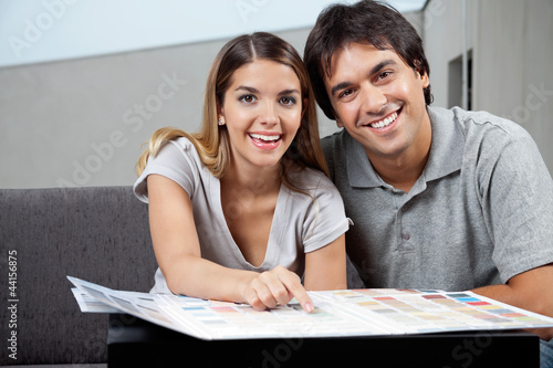 Photo: Couple Choosing Color Samples Couple Choosing Color Samples