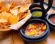 Photo: Mexican appetizer of nacho chips and sauces Mexican appetizer of nacho chips and sauces