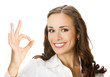 Business woman with okay gesture, on white