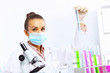 Photo: Young female scientist working in laboratory Young female scientist working in laboratory