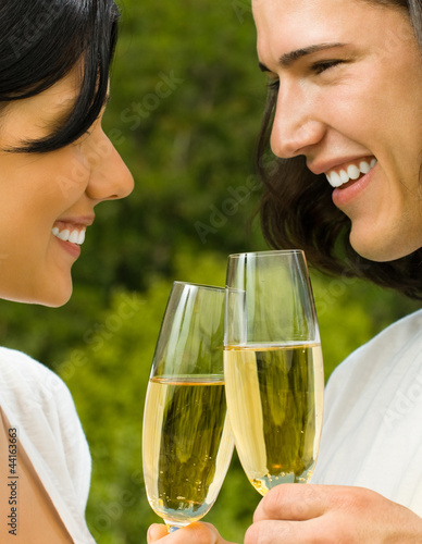Photo: Young happy couple with champagne, outdoor Young happy couple with champagne, outdoor