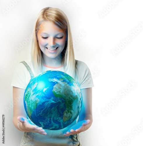 Photo: Girl holding the Planet Earth Girl holding the Planet Earth