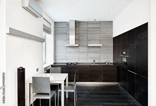 Photo: Modern minimalism style kitchen interior in monochrome tones Modern minimalism style kitchen interior in monochrome tones