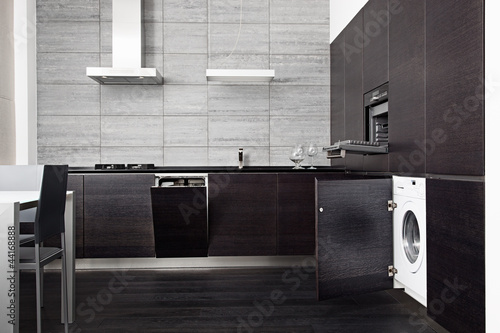Photo: Part of black hardwood kitchen with build-in domestic technique Part of black hardwood kitchen with build-in domestic technique