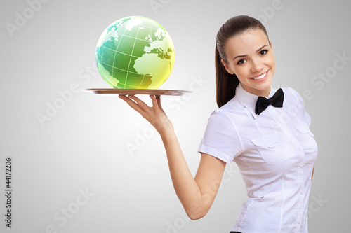 Photo: Waitress with a tray with green symbol on it Waitress with a tray with green symbol on it