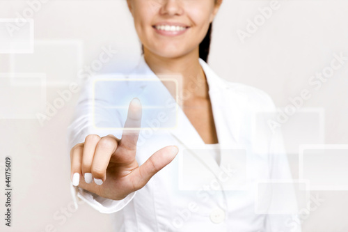 Photo: Hand pushing touch screen button. Hand pushing touch screen button.