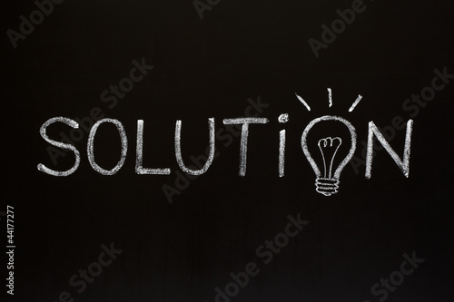 Photo: Solution concept on blackboard Solution concept on blackboard