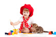 small artist child painting with kitten