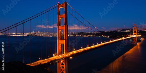 Photo: Panoramic view of the Golden Gate bridge by night in San Francis Panoramic view of the Golden Gate bridge by night in San Francis
