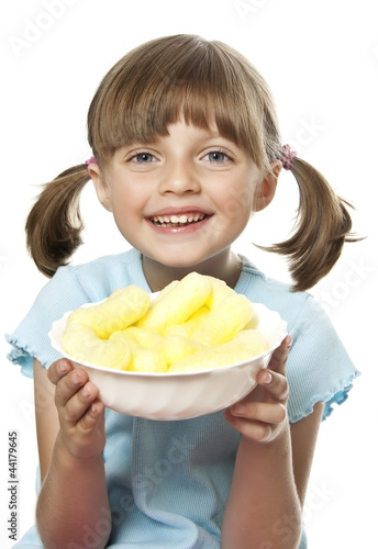 Photo: little girl eating corn nibbles snacks little girl eating corn nibbles snacks