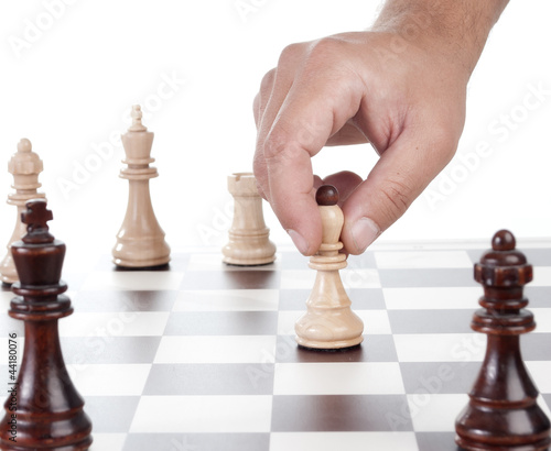 Photo: Hand chess move pawn Hand chess move pawn
