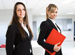Portrait of two beautiful businesswomen at work