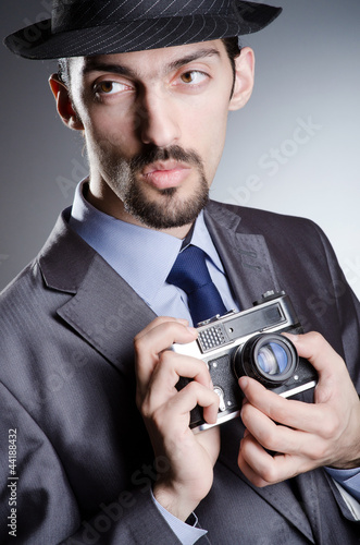 Photo: Photographer man with vintage camera Photographer man with vintage camera