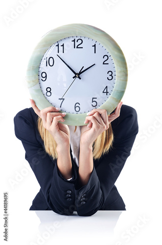 Photo: Businesswoman with clock isolated on white Businesswoman with clock isolated on white