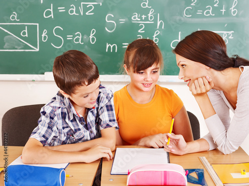 Photo: School child with teacher. School child with teacher.