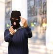 angry criminal man locked in handcuffs