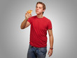 portrait of a young man eating pizza