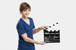 Holding a clapboard