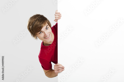 Photo: Man holding a cardboard Man holding a cardboard