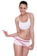 excited woman standing with measuring tape
