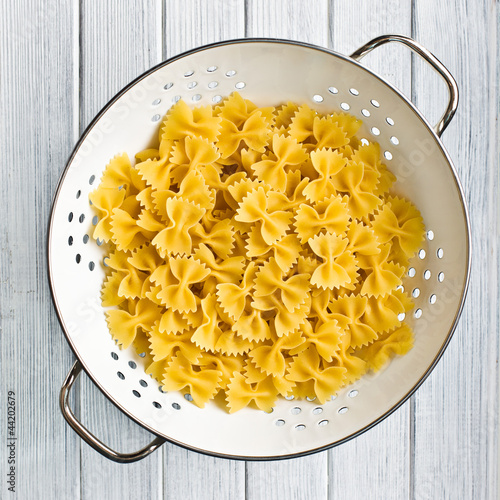 Photo: pasta farfalle in strainer pasta farfalle in strainer