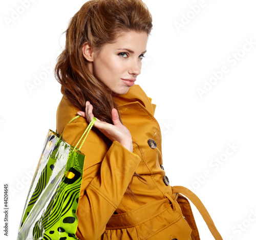 Photo: Young woman with shopping bags over white background Young woman with shopping bags over white background