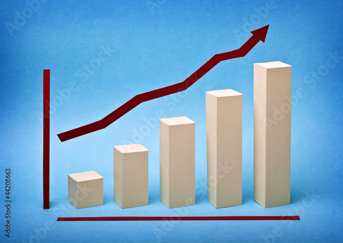 Photo: Business graph chart growth made out of paper Business graph chart growth made out of paper