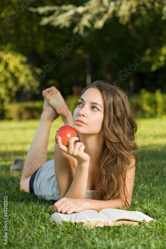 Photo: Gorgeous young brunette student outdoors. Gorgeous young brunette student outdoors.