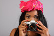 Sexy young woman with a retro film SLR camera.