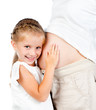 Foto: little girl with stomach of pregnant mother little girl with stomach of pregnant mother