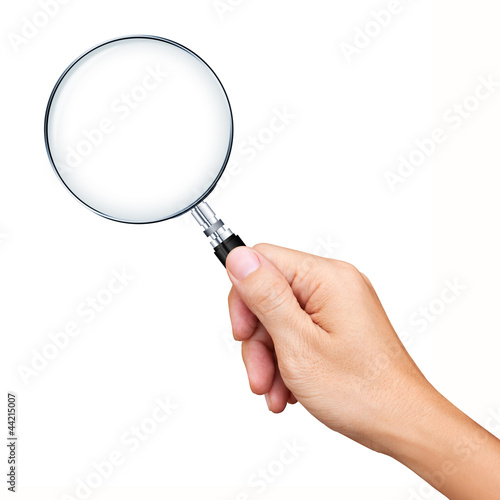 Photo: Hand holding magnifying glass isolated on white background Hand holding magnifying glass isolated on white background