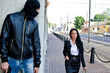 Bandit in mask with gun waiting for victim