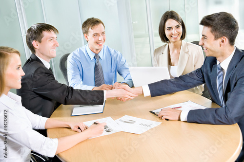 Photo: Business people shaking hands Business people shaking hands