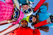 Skiing, winter fun - happy family ski team