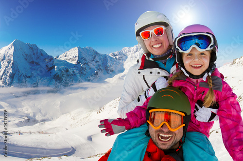 Photo: Skiing, winter fun - happy family ski team Skiing, winter fun - happy family ski team