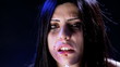 Woman crying with blood in her face