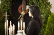 woman at funeral mourning