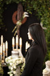 woman at funeral mourning