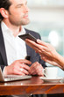 Working colleagues - man and woman - sitting in cafe